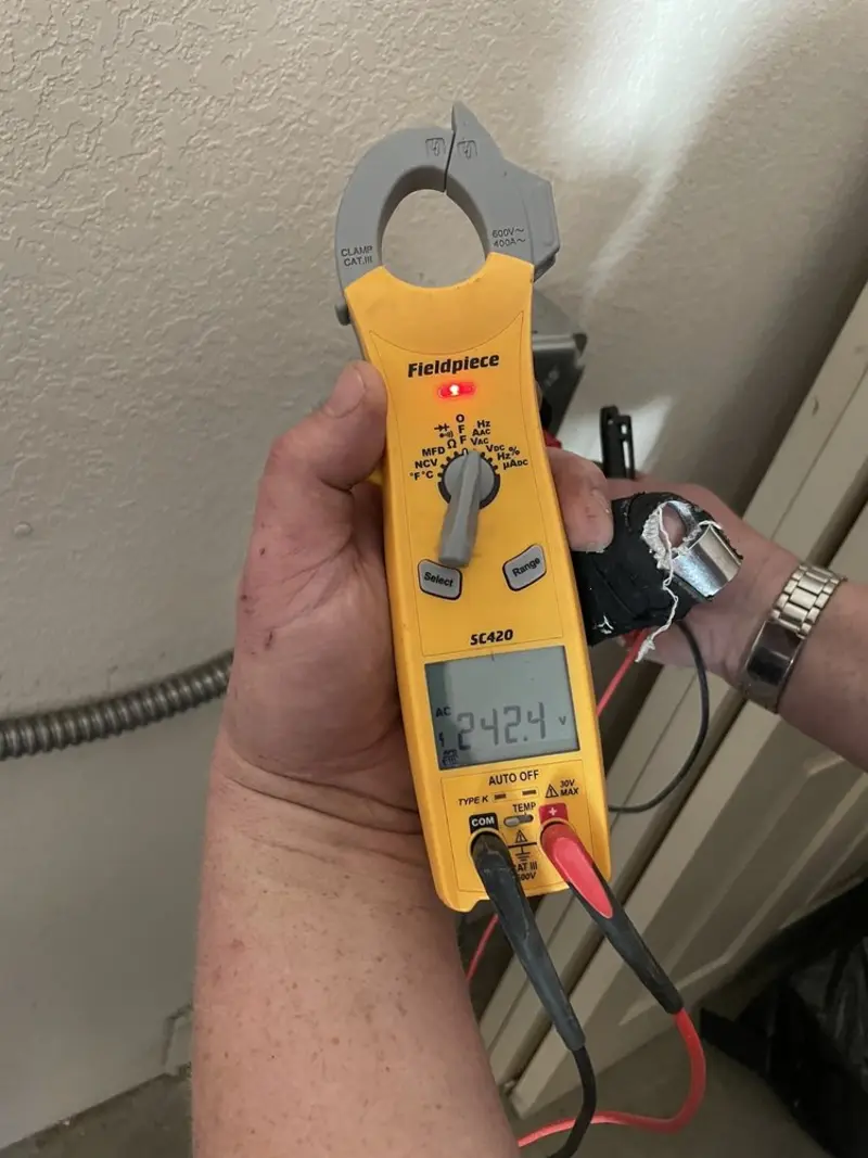 Voltage testing with clamp meter during Electrical Installation Services in Lakeland